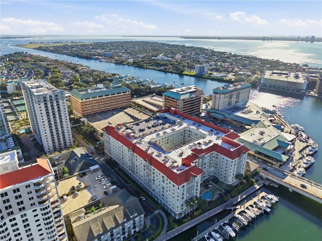 Aerial view of a large waterfront apartment complex with a central courtyard and boat slips — 700 S HARBOUR ISLAND BOULEVARD UNIT 240, TAMPA, FL