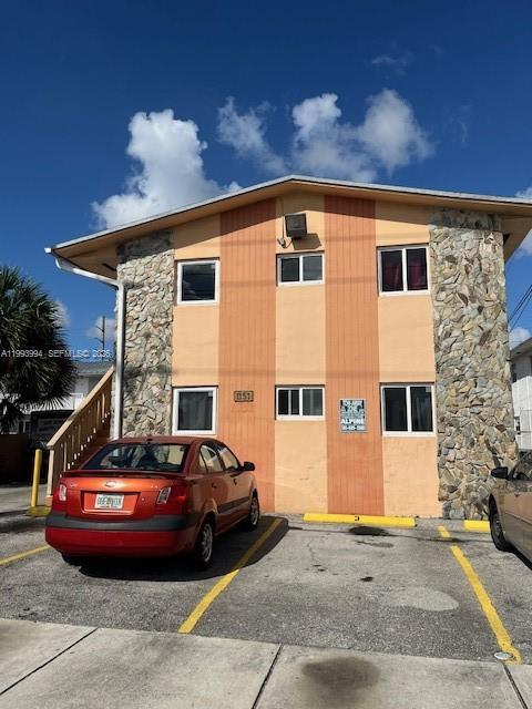 A two-story building with stone-clad sides and a red sedan parked in front — 1151 W 28th St # 9, Hialeah FL 33010, HIALEAH, FL
