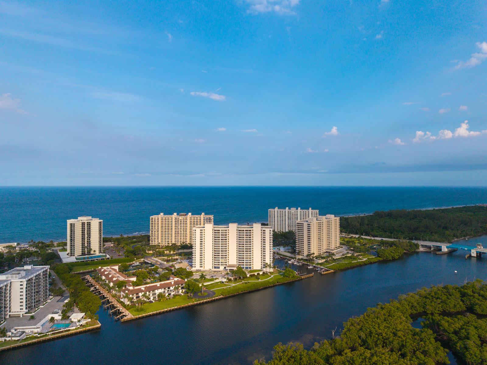 An aerial view of high-rise condominiums situated along a waterway near the ocean — 4201 N Ocean Boulevard # 508, Boca Raton FL 33431, BOCA RATON, FL