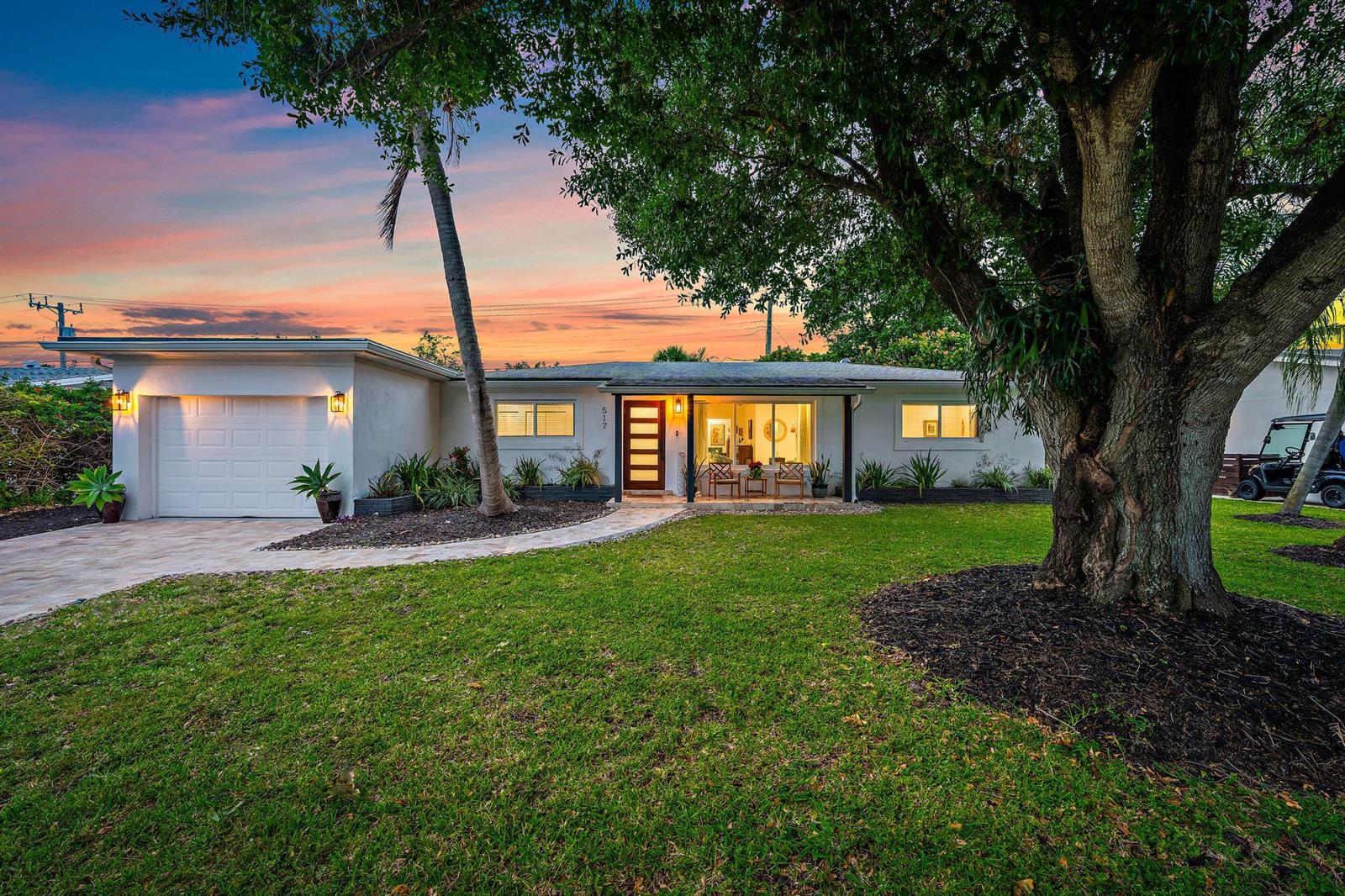 A single-story house with a white exterior, a garage, and a large tree in front — 517 Gulf Road, North Palm Beach FL 33408, NORTH PALM BEACH, FL