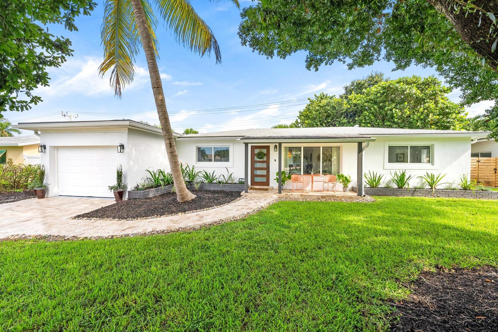 A single-story white house with a garage, a palm tree, and a landscaped front yard — 517 Gulf Road, North Palm Beach FL 33408, NORTH PALM BEACH, FL