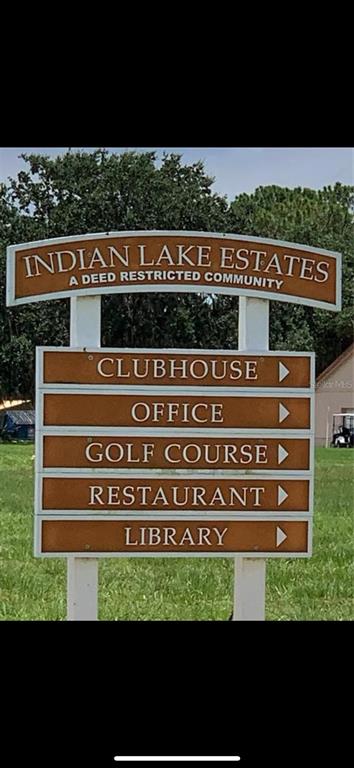 A brown sign for Indian Lake Estates lists the clubhouse, office, golf course, restaurant, and library — 1020 ALTHEA DRIVE, INDIAN LAKE ESTATES, FL