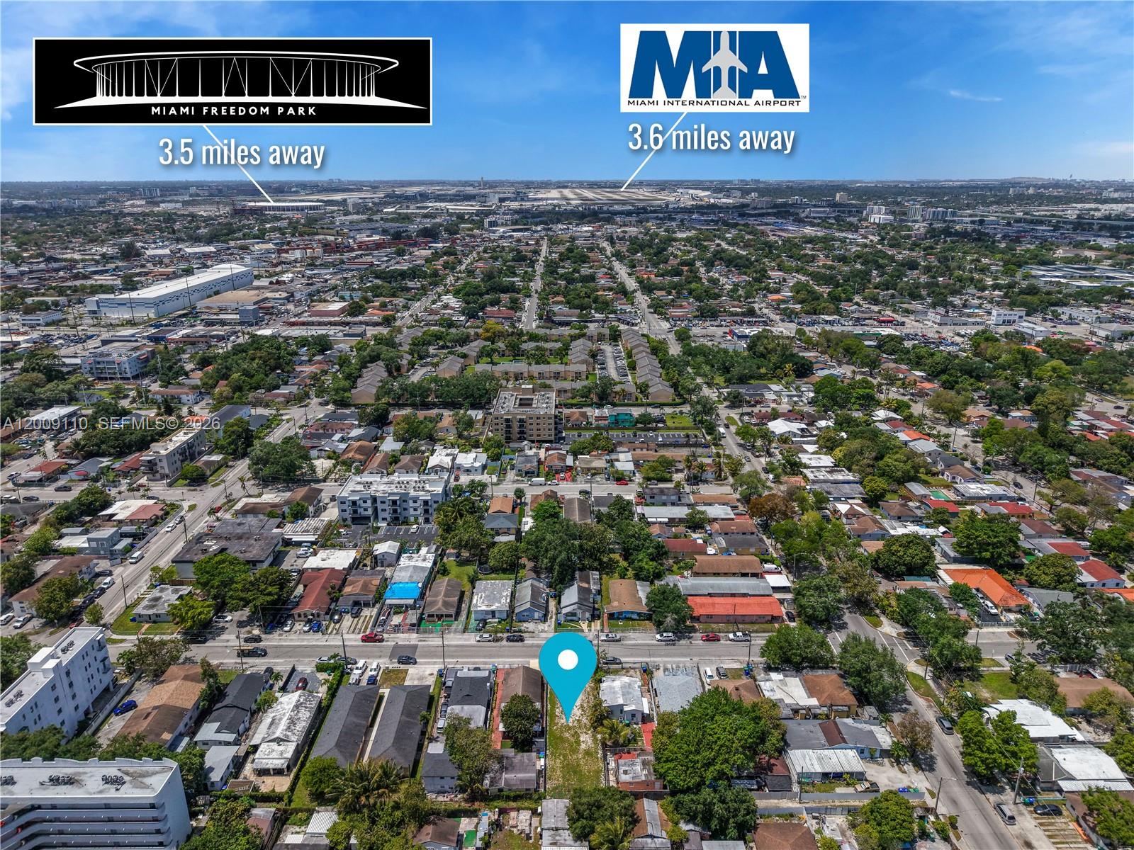 This aerial view shows a vacant residential lot marked with a blue pin — 2709 NW 24th Ave, Miami FL 33142, MIAMI, FL