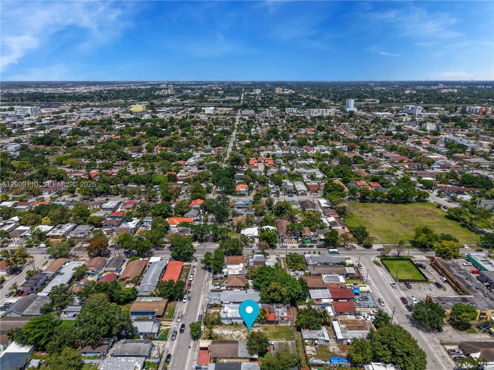 An aerial view shows a residential neighborhood with a blue location pin on a lot — 2709 NW 24th Ave, Miami FL 33142, MIAMI, FL