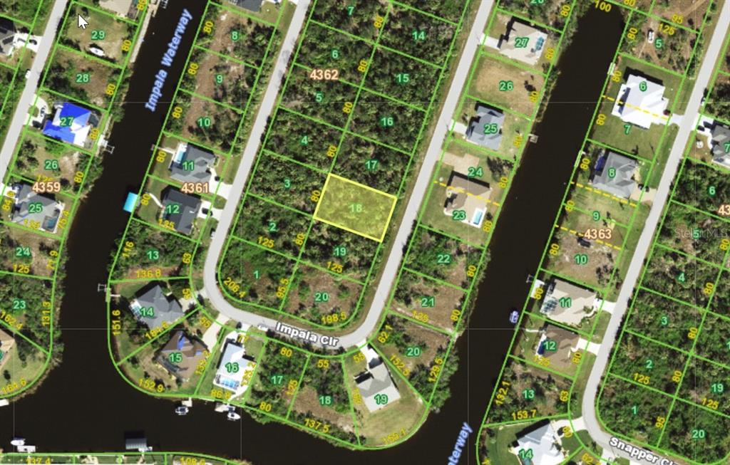 This is an aerial map showing residential lots and waterways in a suburban neighborhood — 9391 IMPALA CIRCLE, PORT CHARLOTTE, FL