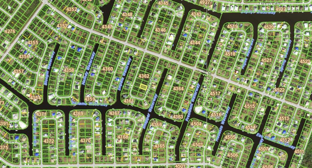 This is an aerial map showing residential lots and waterways in a suburban neighborhood — 9391 IMPALA CIRCLE, PORT CHARLOTTE, FL