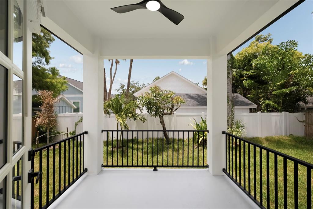 An aerial view shows a coastal neighborhood with houses, streets, and a winding waterway — 1632 BALLARD PARK DRIVE, BRADENTON, FL