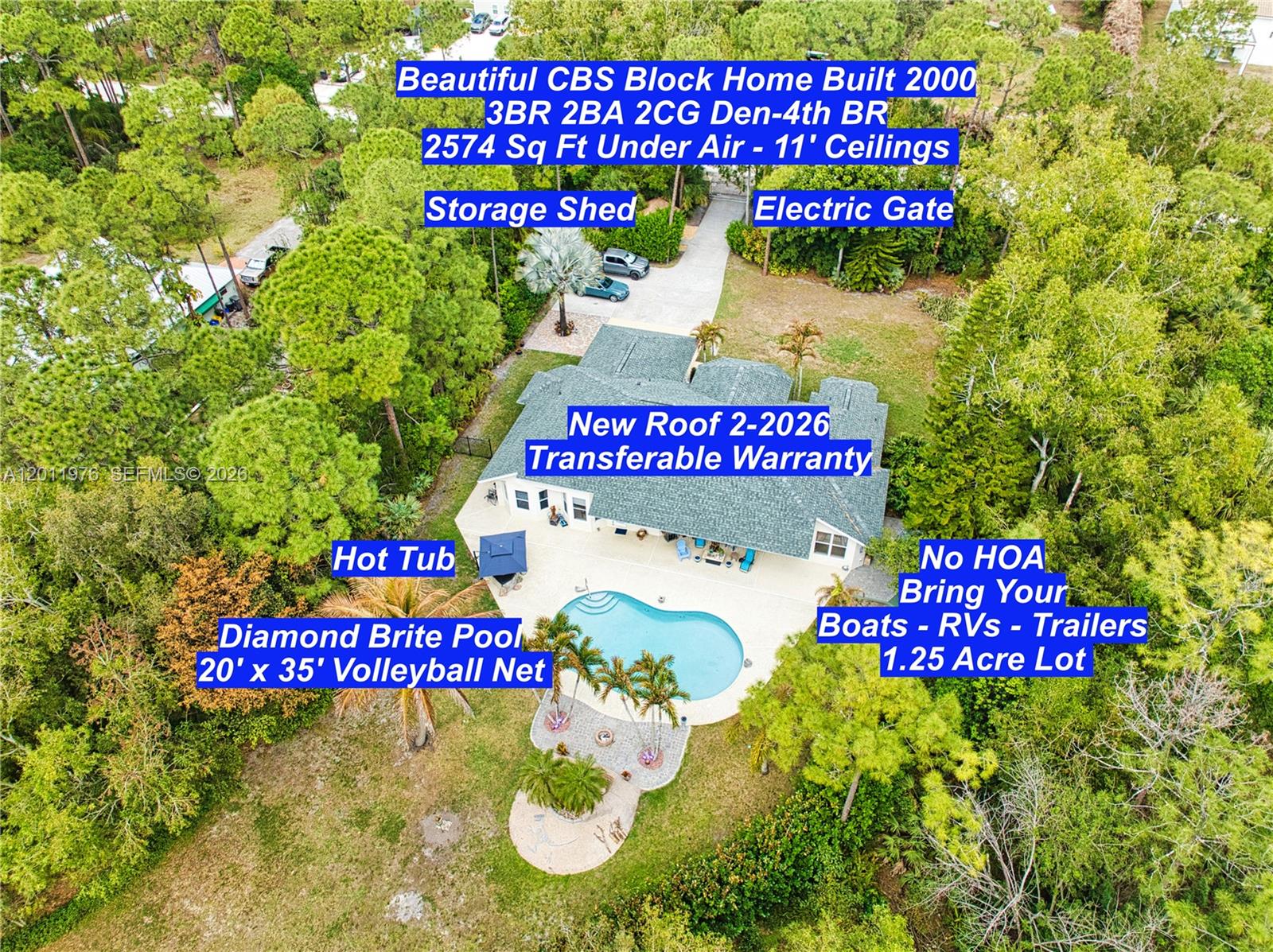 An aerial view shows a house with a pool, hot tub, and large wooded lot — 11576 N 153rd Ct N, Jupiter FL 33478, JUPITER, FL