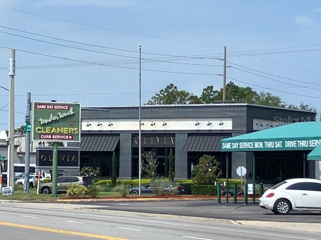 A commercial building with a dry cleaner sign and a drive-thru service area — 3501 / 3519 HENDERSON BOULEVARD, TAMPA, FL
