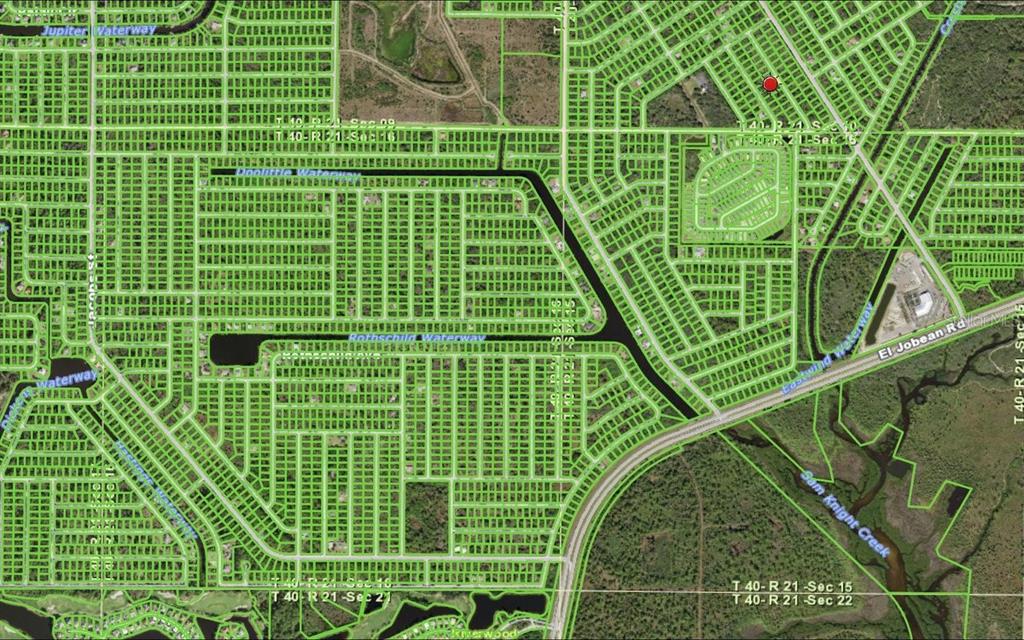 This is a satellite map showing a residential area with a red location marker — 1489 CANDY LANE, PORT CHARLOTTE, FL
