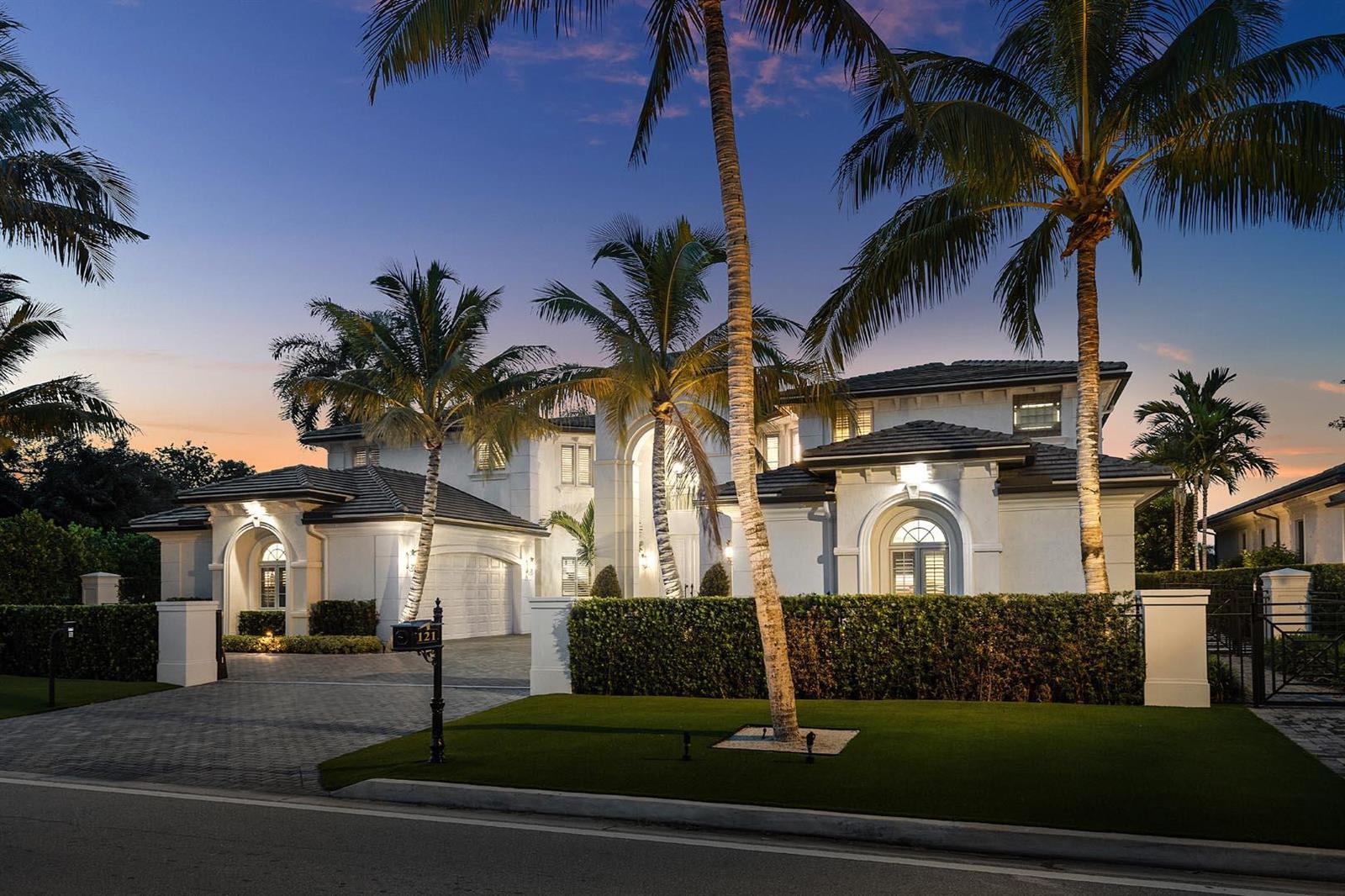 A two-story white stucco house with a tiled roof, palm trees, and a paved driveway — 121 Royal Palm Way, Boca Raton FL 33432, BOCA RATON, FL