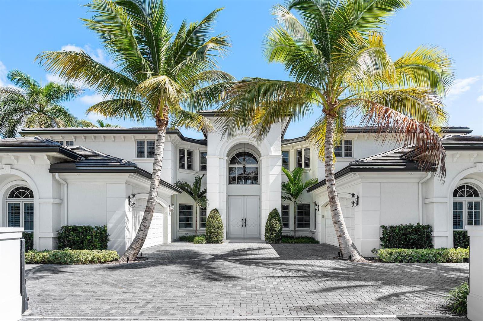 A two-story white house with a paved driveway and two tall palm trees in front — 121 Royal Palm Way, Boca Raton FL 33432, BOCA RATON, FL