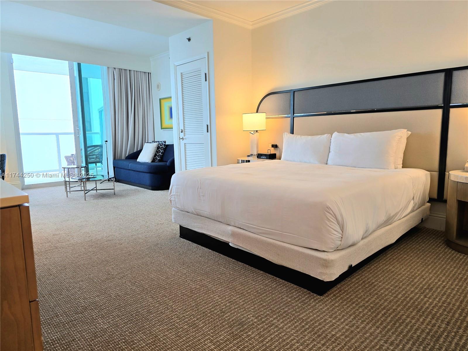 An elevated view shows a large hotel complex with multiple pools and beach access — 4401 Collins Ave # 1401, Miami Beach FL 33140, MIAMI BEACH, FL