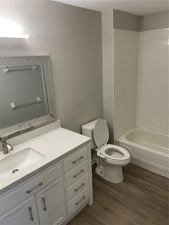 A bathroom features a white vanity, a toilet with a bidet, and a tiled shower-tub — 3960 SOUTHPOINTE DRIVE UNIT 507, ORLANDO, FL