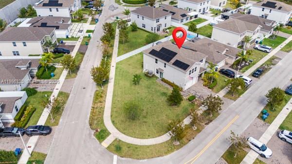 An aerial view shows a two-story suburban house with solar panels on the roof — 13235 SW 270th Ter, Homestead FL 33032, HOMESTEAD, FL