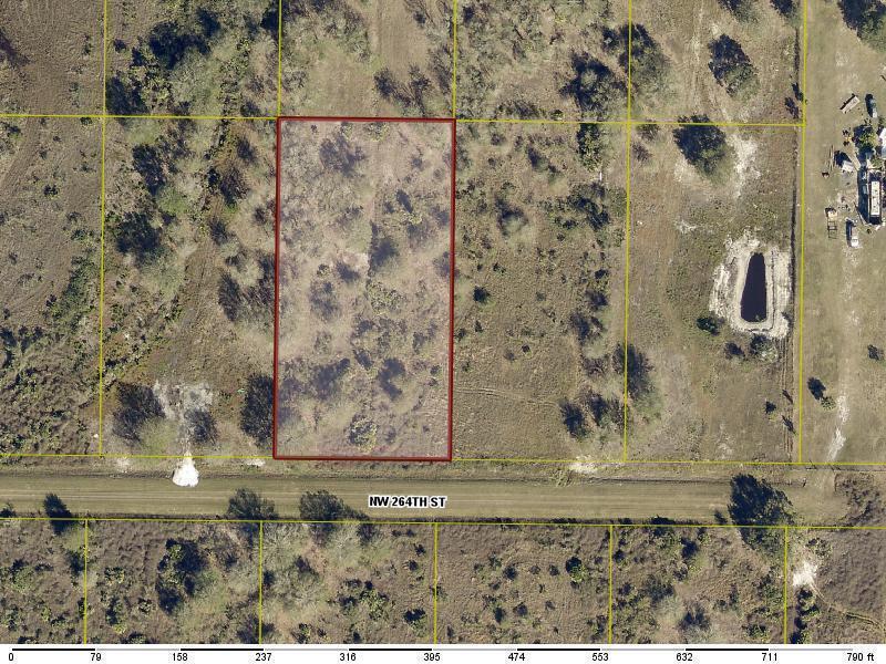This aerial map shows a rectangular parcel of land bordered by a dirt road — 20167 NW 264th Street, Okeechobee FL 34972, OKEECHOBEE, FL