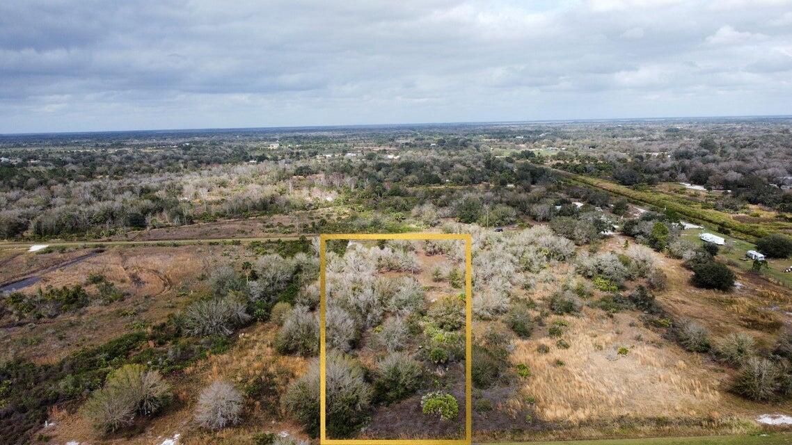 An aerial view shows a rectangular plot of land highlighted by a yellow border — 20167 NW 264th Street, Okeechobee FL 34972, OKEECHOBEE, FL