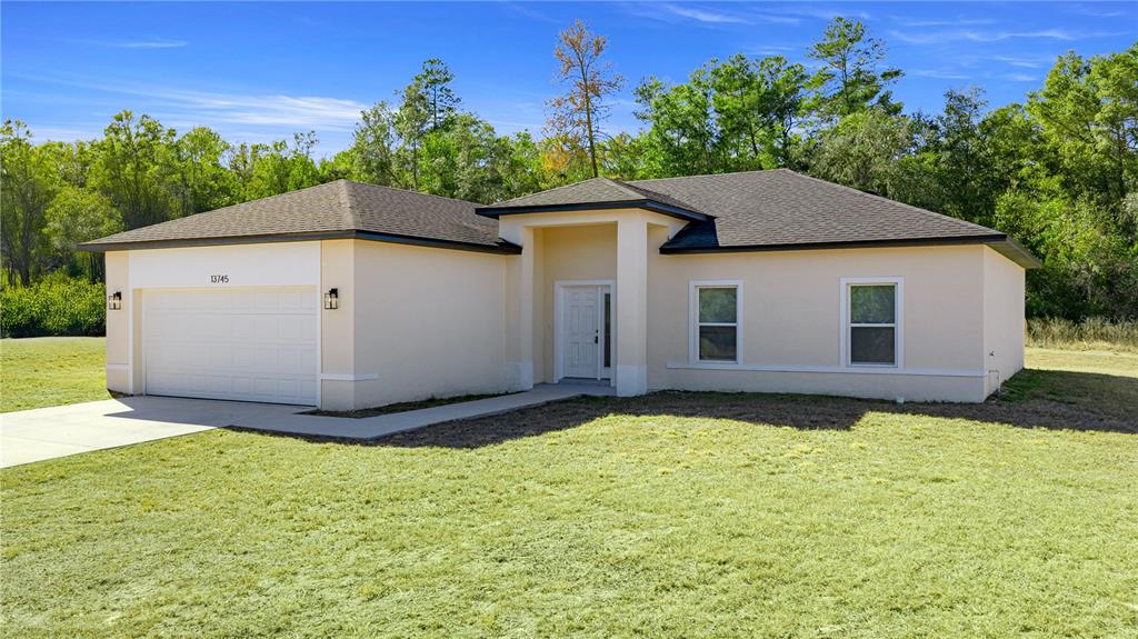 This collage shows a single-story house exterior, an open-concept living area, a bedroom, and an aerial view — 13745 SW 43RD CIRCLE, OCALA, FL