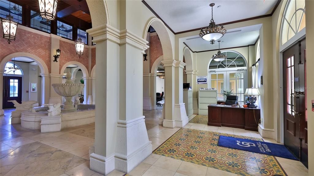 A lobby features a stone fountain, decorative tile flooring, arched entryways, and a reception desk — 1 HAMMOCK BEACH PARKWAY, PALM COAST, FL