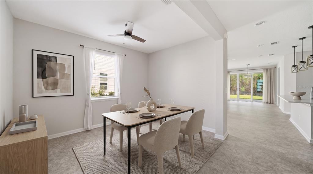 A dining room with a table, four chairs, a ceiling fan, and tile flooring — 1937 AMBERLY DRIVE, MIDDLEBURG, FL