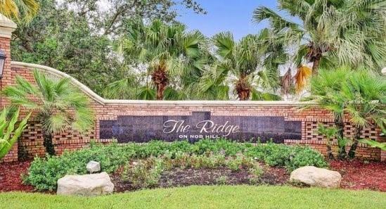 A brick monument sign for The Ridge on Nob Hill surrounded by palm trees and landscaping — 2721 W Abiaca Circle, Davie FL 33328, DAVIE, FL