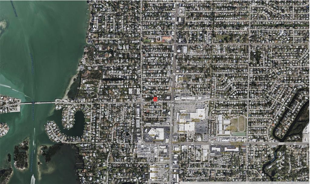 This is an aerial map showing a residential area with a red square marking a property — 1871 SIESTA DRIVE, SARASOTA, FL