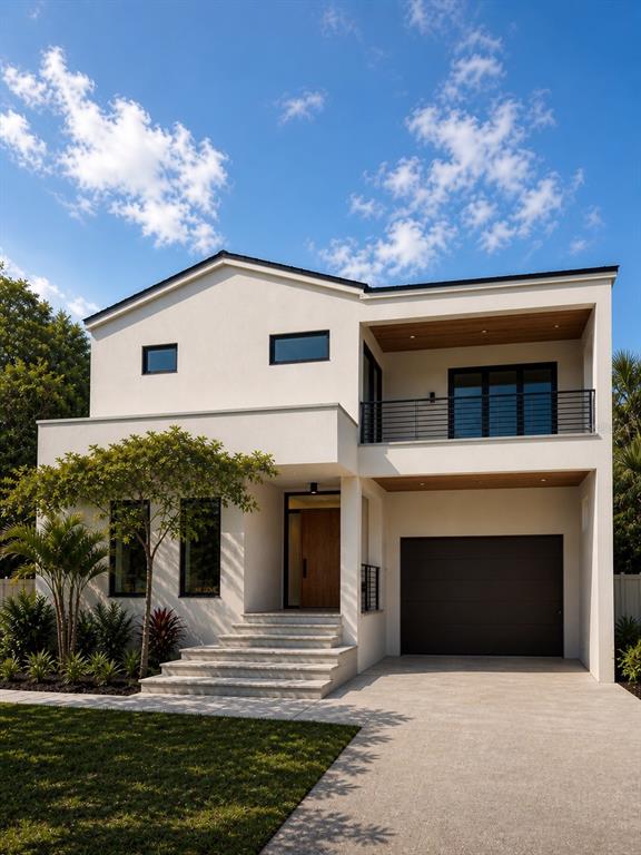 A modern two-story house with a white stucco exterior, a balcony, and a concrete driveway — 1681 OAK STREET, SARASOTA, FL