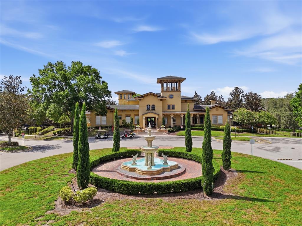 A ground-floor apartment unit with a yellow stucco exterior and a private entrance — 114 VISTA VERDI CIRCLE UNIT 112, LAKE MARY, FL