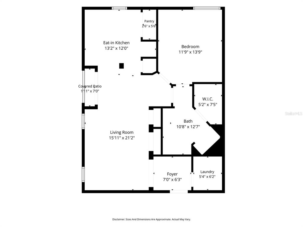 This is a floor plan of a one-bedroom apartment with a kitchen, living room, and bath — 114 VISTA VERDI CIRCLE UNIT 112, LAKE MARY, FL