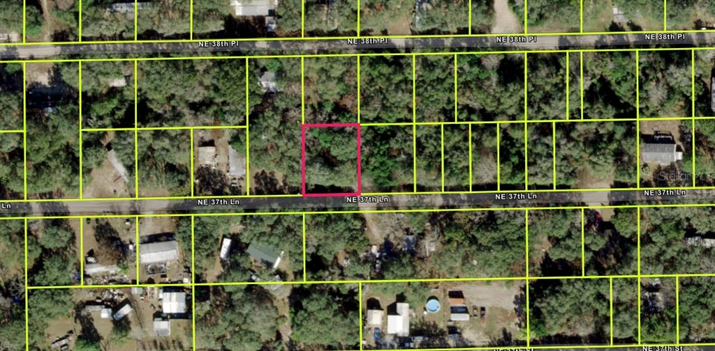 This is an aerial map showing a highlighted vacant lot among other residential properties — 17185 NE 37TH LANE, SILVER SPRINGS, FL