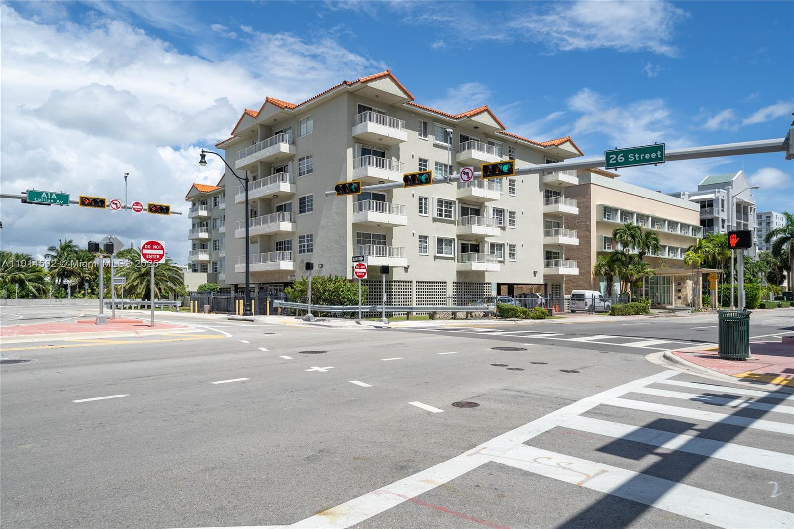 An exterior view of a multi-story apartment building at a street intersection — 2600 Collins Ave # 308, Miami Beach FL 33140, MIAMI BEACH, FL