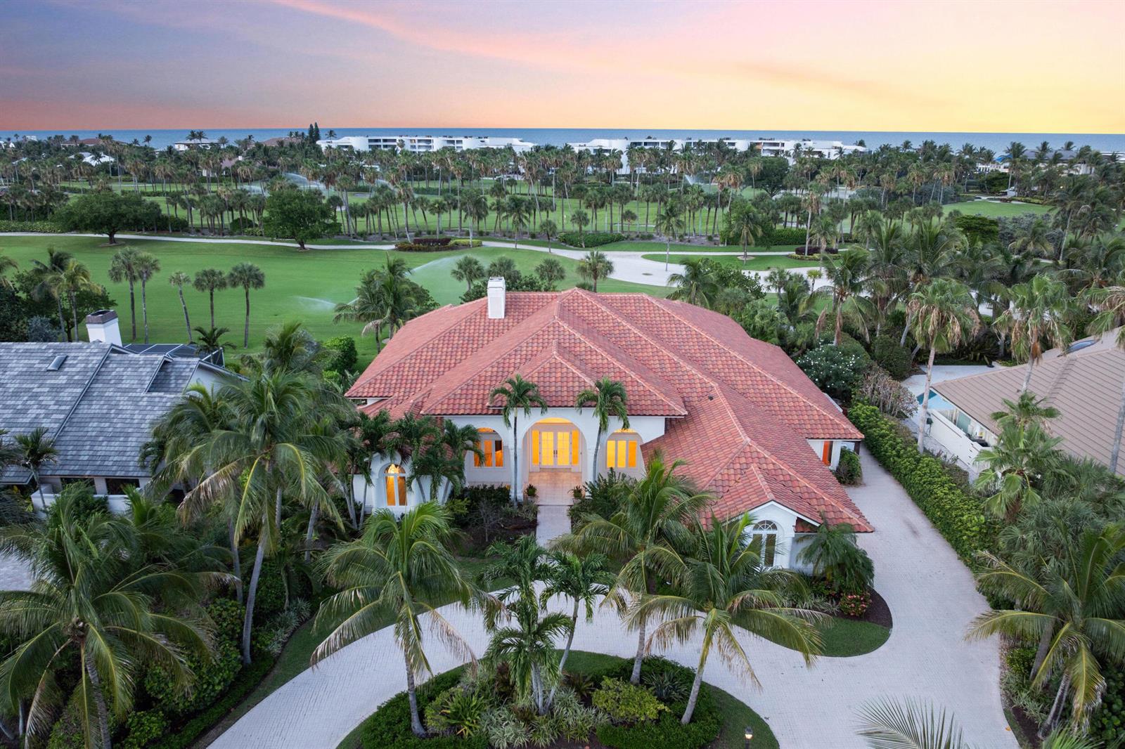 An aerial view of a single-story house with a red tile roof and palm trees — 6841 SE Harbor Circle, Stuart FL 34996, STUART, FL