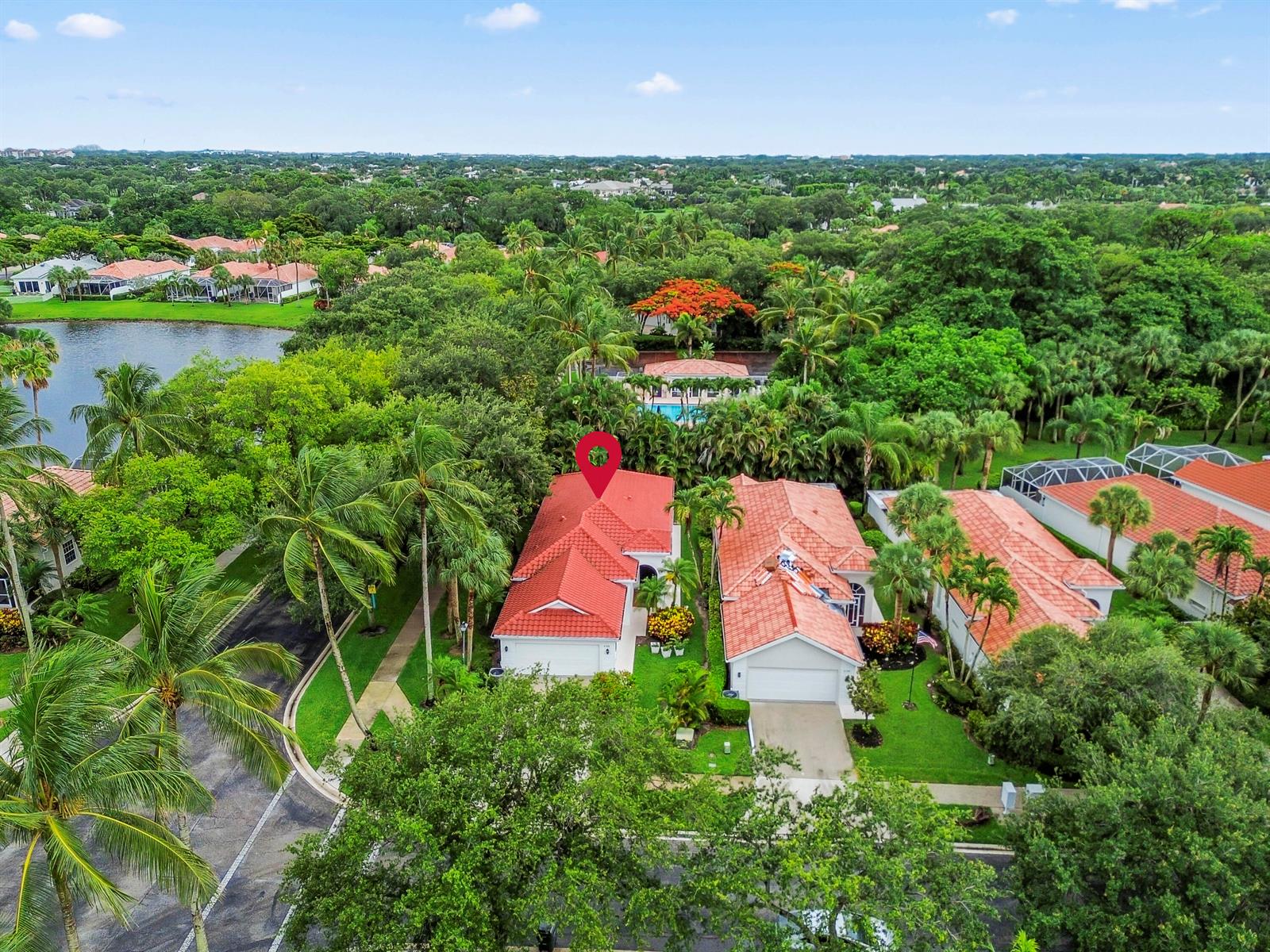 An aerial view shows a residential street with houses featuring red tile roofs and landscaping — 4766 Valencia Drive, Delray Beach FL 33445, DELRAY BEACH, FL