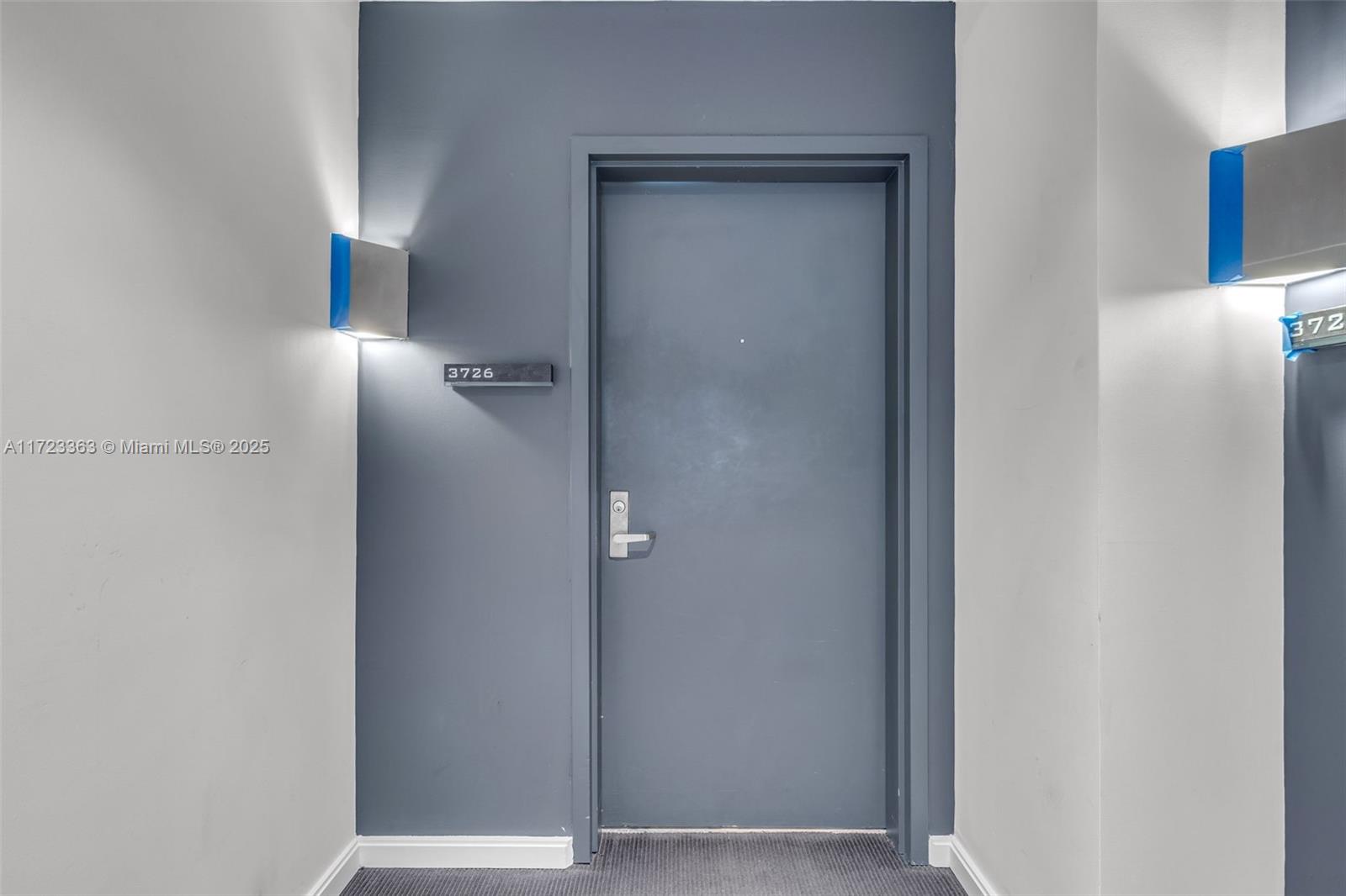 A gray apartment door with the number 3726 is flanked by two wall-mounted light fixtures — 325 S Biscayne Blvd # 3726, Miami FL 33131, MIAMI, FL