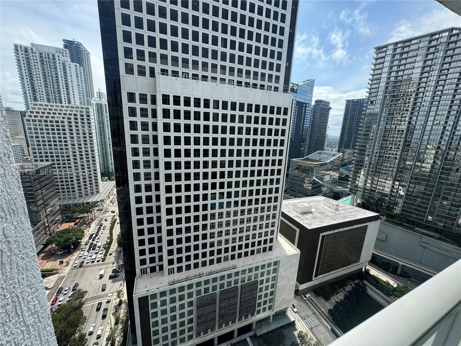 An elevated view of a city skyline featuring several modern high-rise buildings and streets — 500 Brickell Ave # 3204, Miami FL 33131, MIAMI, FL