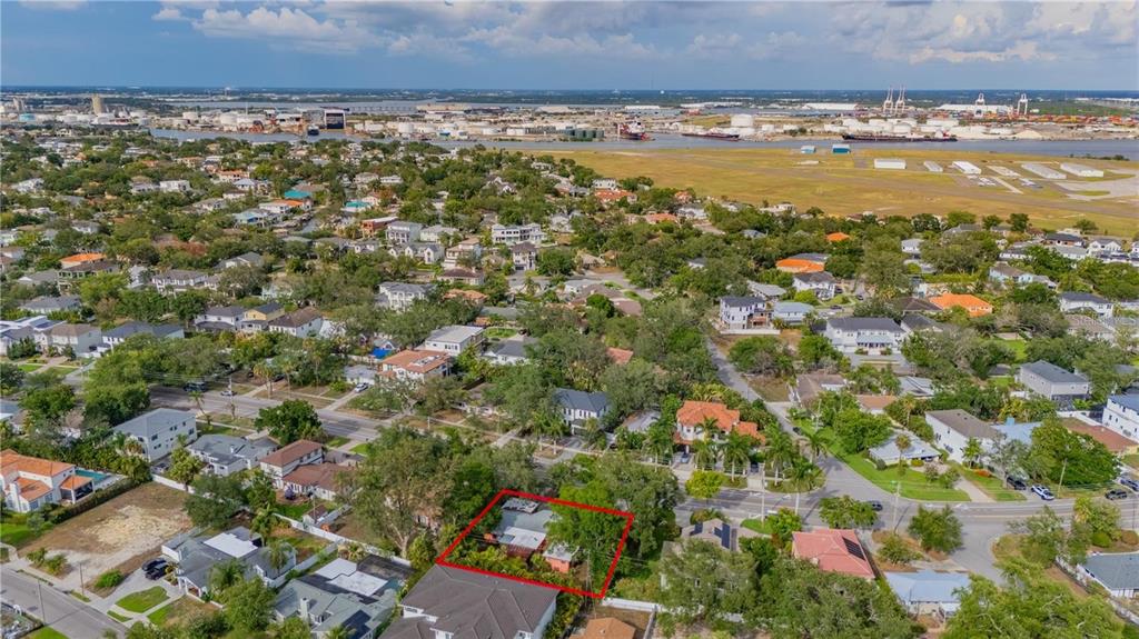 An aerial view shows a residential property outlined in red within a suburban neighborhood — 504 W DAVIS BOULEVARD, TAMPA, FL