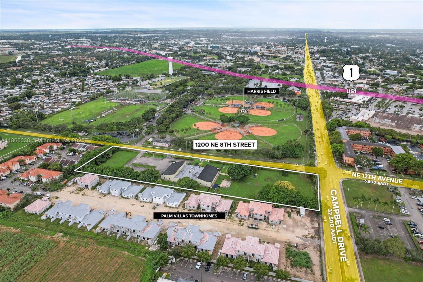 This aerial view shows a rectangular property lot adjacent to a baseball field and road — 1200 NE 8th St, Homestead FL 33033, HOMESTEAD, FL