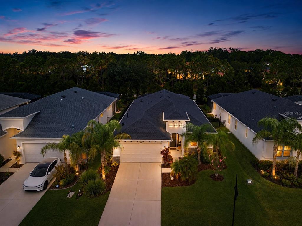 A screened-in patio features a swimming pool with built-in steps and a concrete deck — 4427 RENWICK DRIVE, PARRISH, FL