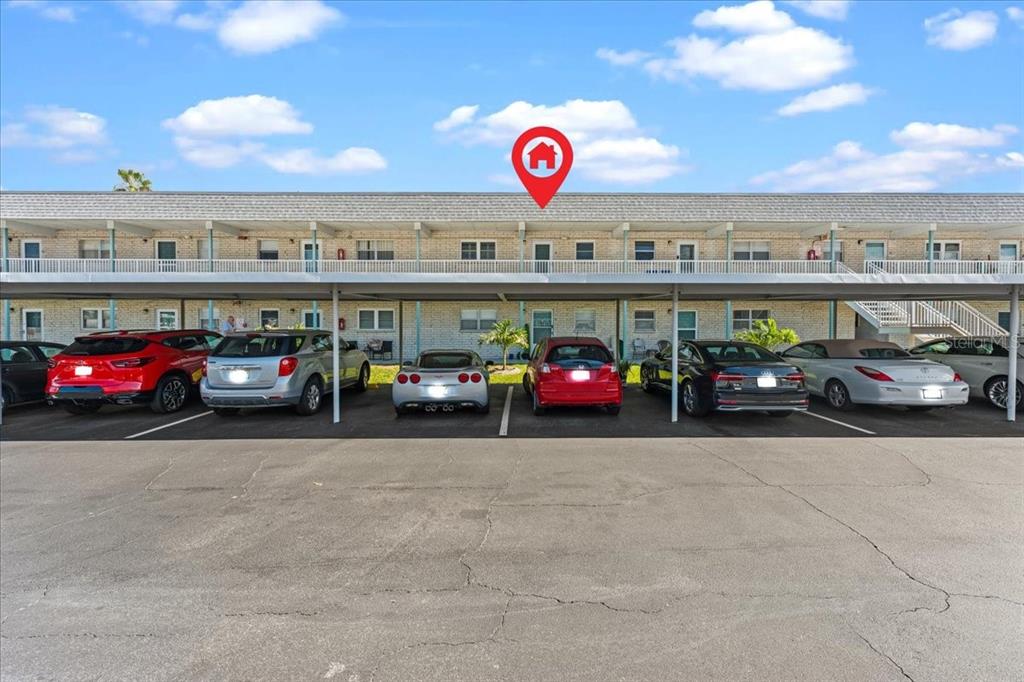 A two-story apartment building with a covered parking area in front — 5357 81ST STREET N UNIT 18, ST PETERSBURG, FL