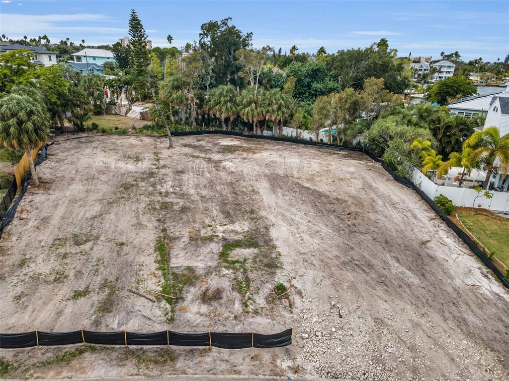 An aerial view of a cleared, vacant residential lot surrounded by trees and fencing — 370 12TH AVENUE, INDIAN ROCKS BEACH, FL