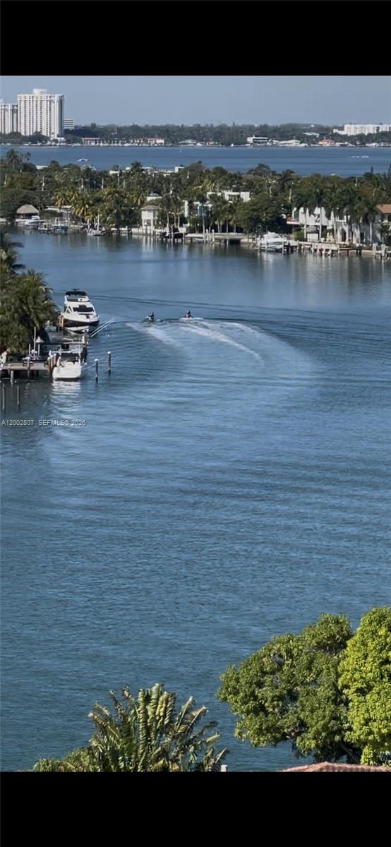 An elevated view of a waterway with boats, jet skis, and waterfront homes — 7441 Wayne Ave # 11A, Miami Beach FL 33141, MIAMI BEACH, FL