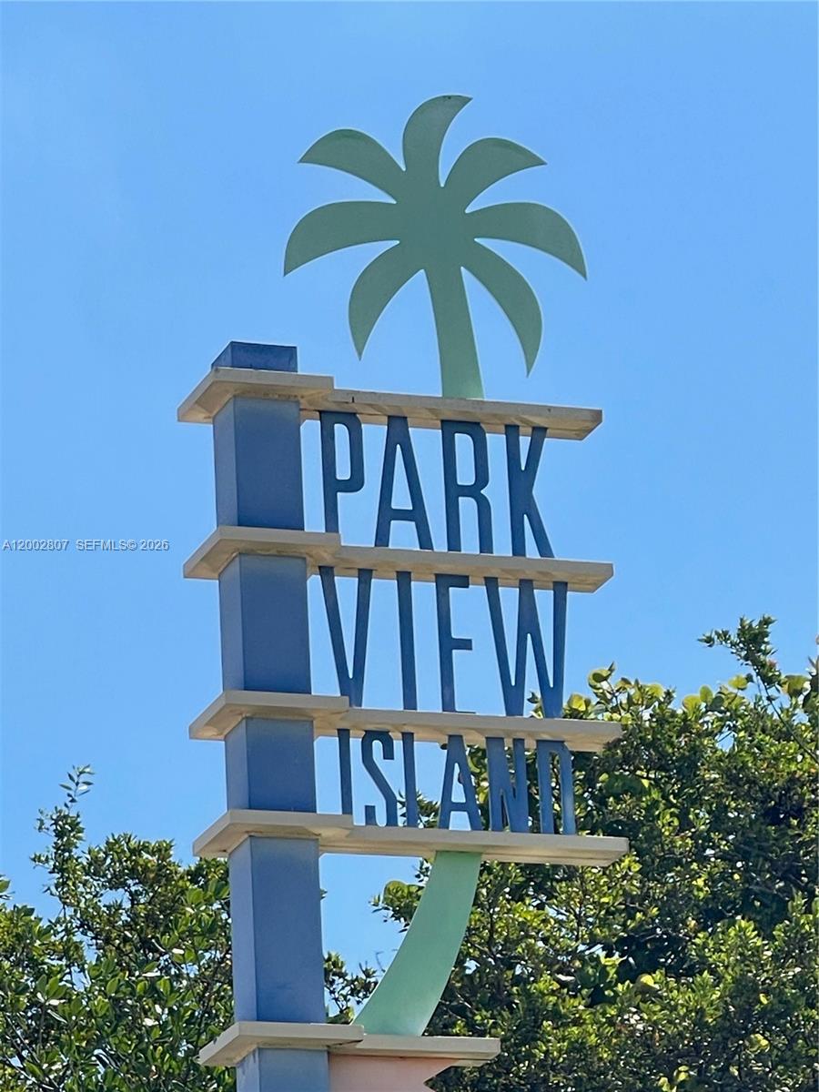 A sign for Park View Island stands against a clear blue sky above green foliage — 7441 Wayne Ave # 11A, Miami Beach FL 33141, MIAMI BEACH, FL