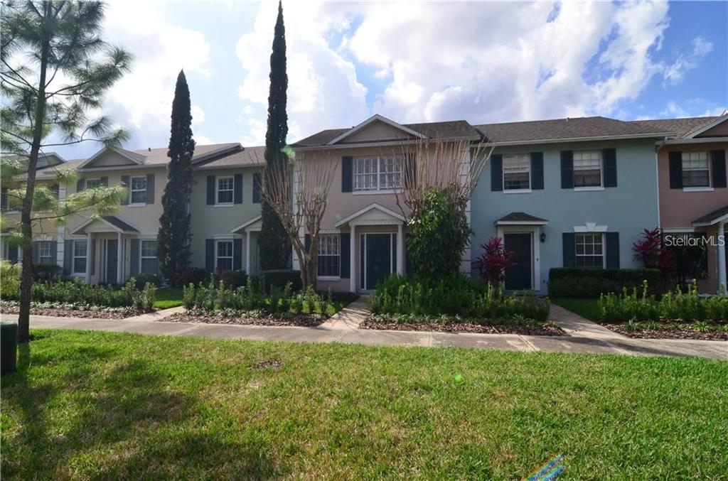 An empty room with white walls, white tile flooring, a ceiling fan, and a pass-through window — 106 S PRIMROSE DRIVE, ORLANDO, FL