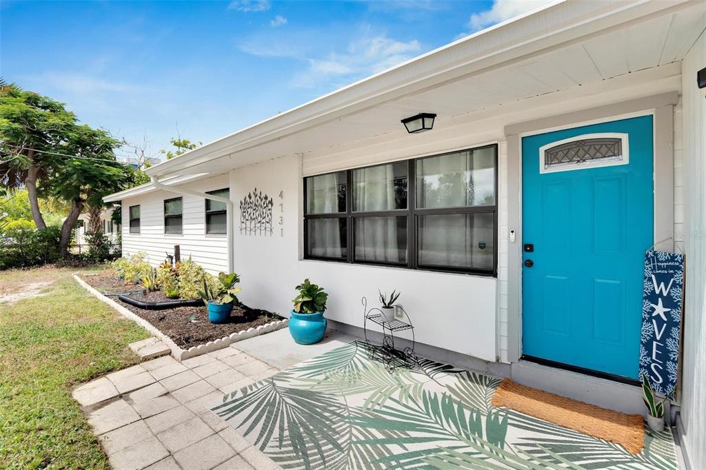 A backyard features a patio, an above-ground pool, a storage shed, and turquoise Adirondack chairs — 4731 W MONTGOMERY AVENUE, TAMPA, FL