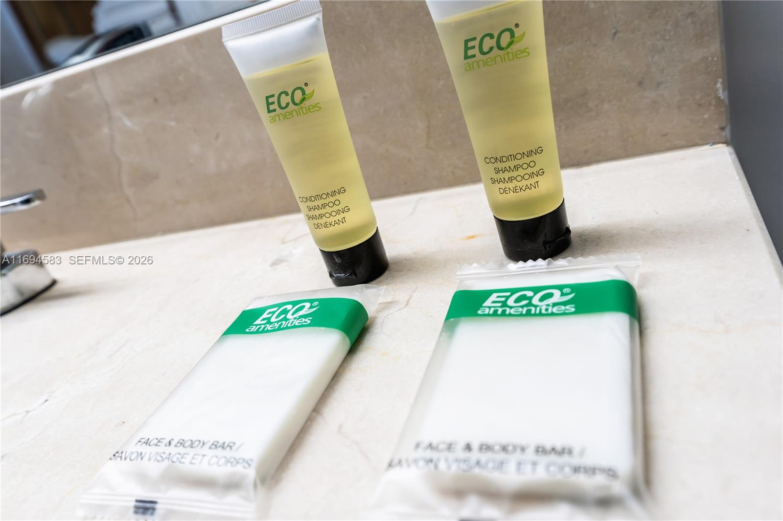 Two tubes of conditioning shampoo and two bars of soap sit on a marble countertop — 1750 N Bayshore Dr # 5014, Miami FL 33132, MIAMI, FL
