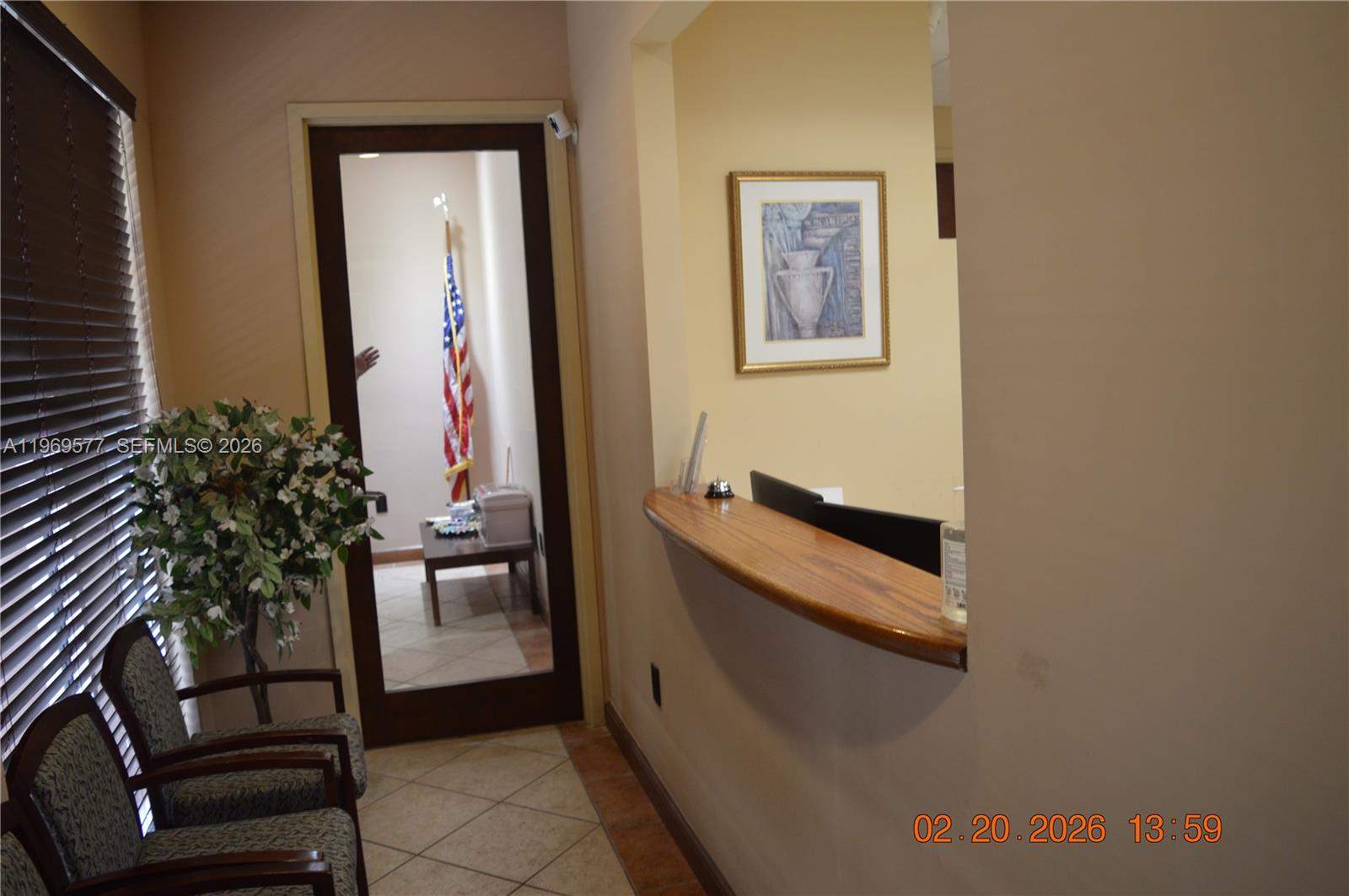 A waiting area features two chairs, a reception counter, and a doorway showing an office — 7779 NW 146th St # 8, Miami Lakes FL 33016, MIAMI LAKES, FL