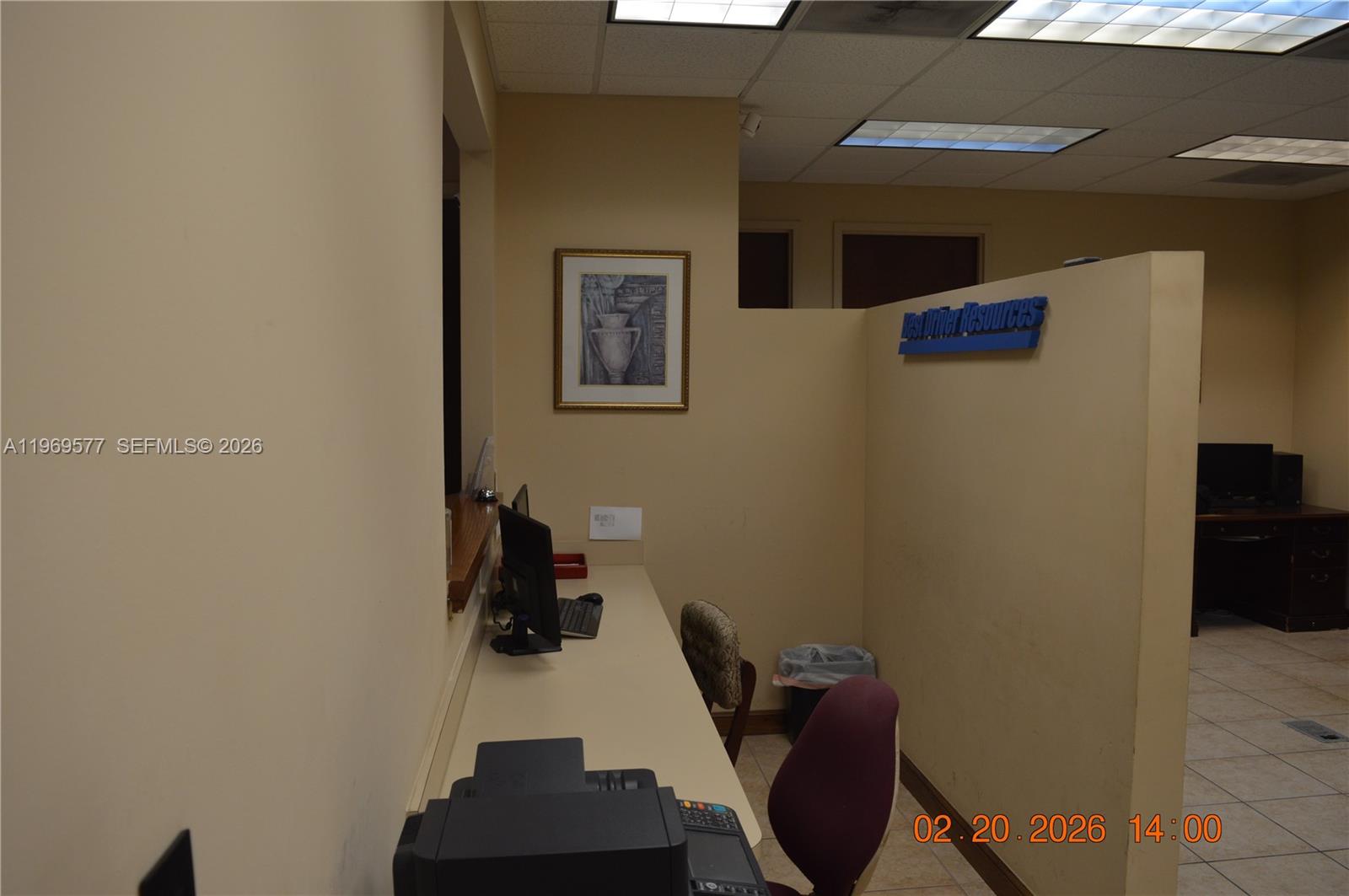 An office space features a desk, a computer, a chair, and a partition wall — 7779 NW 146th St # 8, Miami Lakes FL 33016, MIAMI LAKES, FL