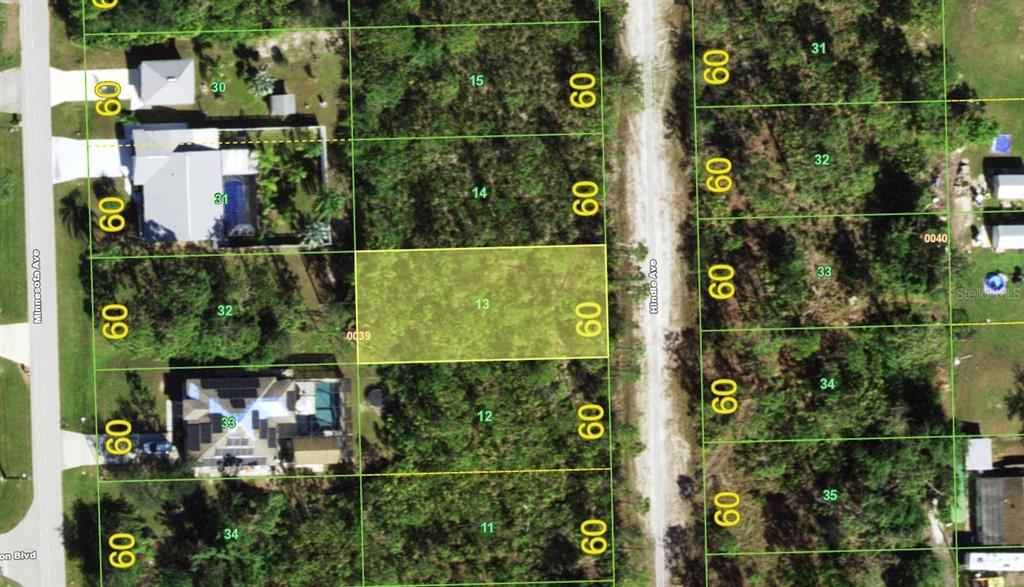 This is an aerial map showing a highlighted vacant lot between two residential streets — 12195 HINDLE AVENUE, PUNTA GORDA, FL