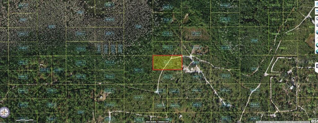 An aerial map shows a rectangular parcel of land outlined in red within a wooded area — HOLOPAW GROVES ROAD, ST CLOUD, FL