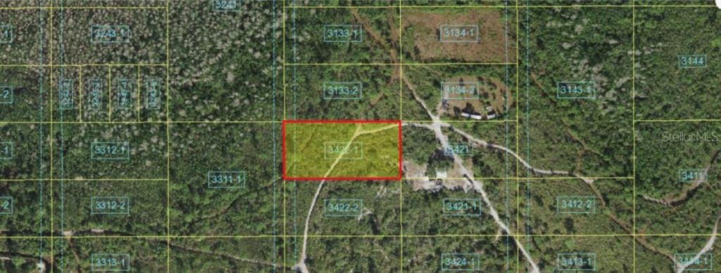 An aerial map view shows a rectangular plot of land highlighted in red — HOLOPAW GROVES ROAD, ST CLOUD, FL